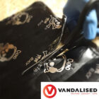 Deadmat van soundproofing roll being cut with scissors